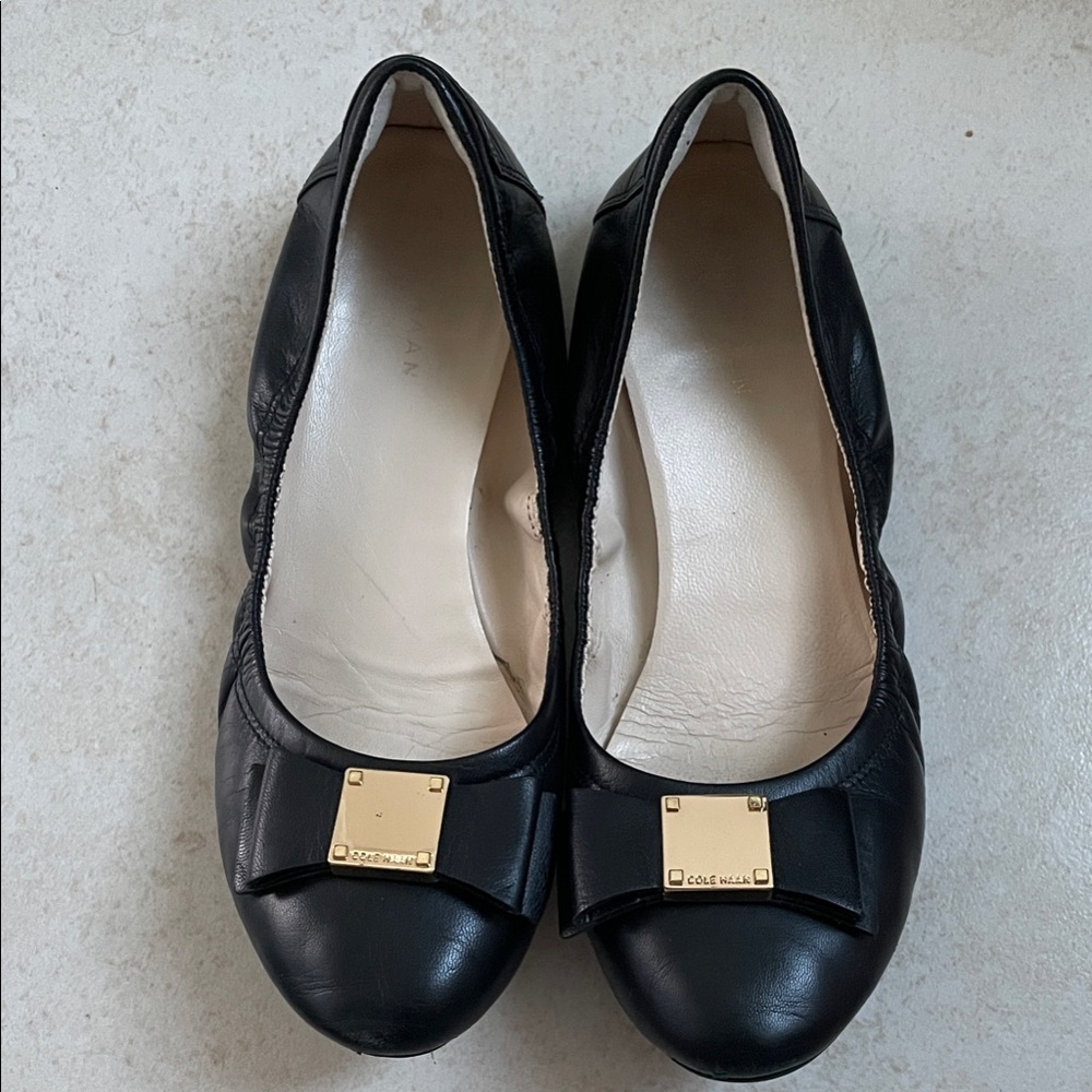 Cole Haan Black Leather Bow Flats with Gold Plaque